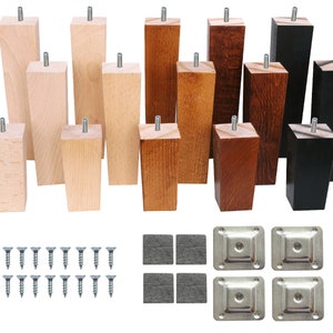 May include: Set of wooden furniture legs in various sizes and finishes, including natural wood, stained wood, and black. The set also includes screws and metal plates for attaching the legs to furniture.