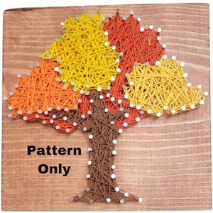 May include: A string art pattern of a tree with three leaves in shades of orange, yellow, and brown. The pattern is on a wooden background. The text "Pattern Only" is printed below the tree.