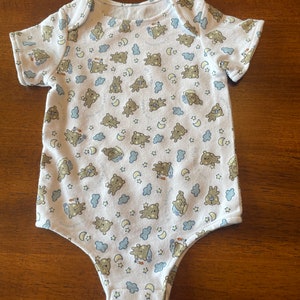 Baby one-piece bodysuit (onsie) made of soft stretchy cotton knit with snap tape crotch. Size 0-3 mos.