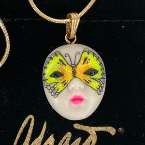 COSMIC FLUTTER face pendant ADAGIO, Swarovski crystal jet eyes. Gold tone chain hand painted neon chartreuse & black mask on fine porcelain.