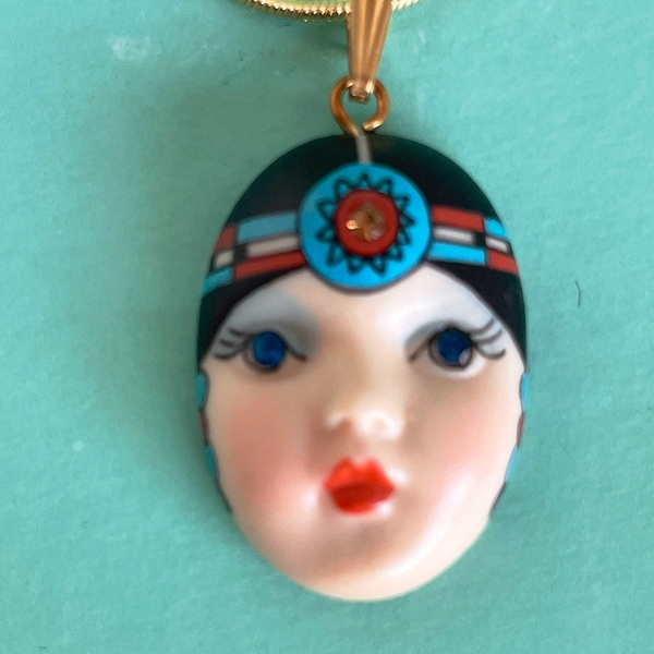 Resilient PHOENIX embodies the cycle of life, ethereal grace & beauty. ADAGIO face necklace with turquoise headdress.