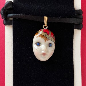 LITTLE PRINCE entitled to bring joy,  happiness, laughter. A gold crowned Prince ADAGIO face necklace for mom, grandma auntie.