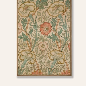 May include: A vintage floral print featuring a repeating pattern of pink, yellow, and green flowers on a cream background. The print is framed in a light brown wood frame.