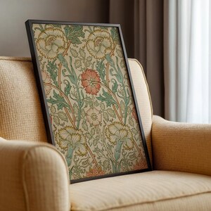 May include: A framed print of a vintage floral design featuring pink, white, and green flowers on a cream background.