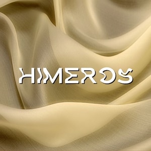 May include: A close-up of a light beige sheer fabric with the word "HIMEROS" written in white letters.