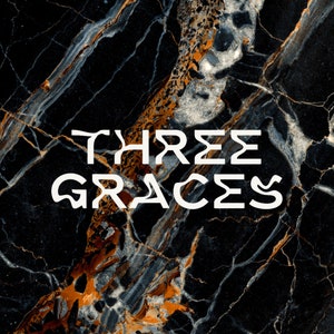 May include: Black and gold marble background with the text "THREE GRACES" in white.