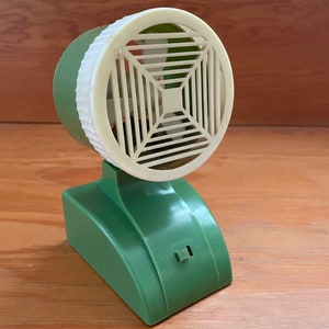 Vintage green and white small battery operated desk fan