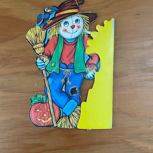 vintage paper halloween scarecrow with paper honeycomb table decoration