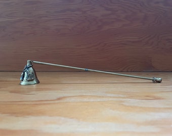 vintage  brass candle snuffer with braided rope detail on bell and hinged handle