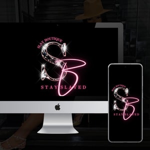 May include: A black and white mockup of a computer screen and a smartphone displaying a logo for a business called "Slay Boutique". The logo features a stylized "S" and "B" with a pink outline and a diamond-like texture. The text "Stay Slay" is written below the logo.