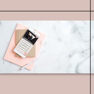 May include: A white smartphone with a pink and gold notebook and a white pen on a white marble surface. The phone screen displays a wedding website with the text "Hello Gorgeous!" and buttons for "RSVP", "Directions", "Dress Code", and "Gift Registry".