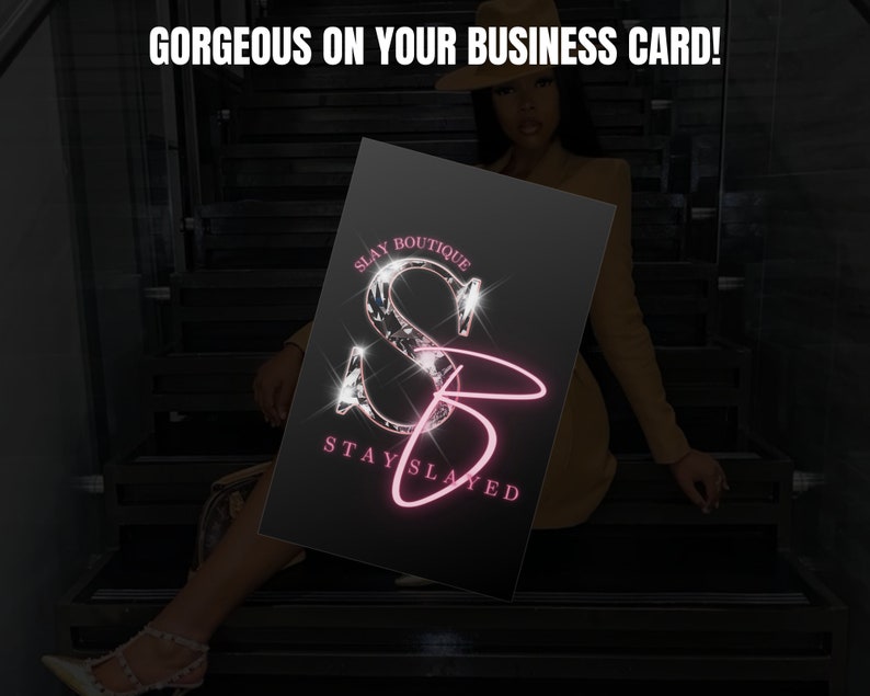 May include: A black business card with a pink and silver logo that says "Slay Boutique" and "Stay Slayed".