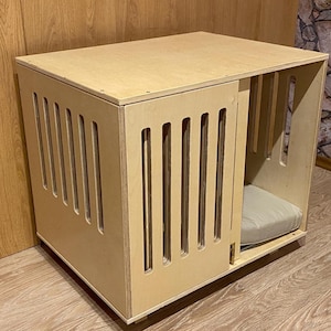 Modern dog crate with sliding door with a latch. Dog kennel, dog house, dog bed, indoor dog house, dog furniture, dog cage. Natural wood.