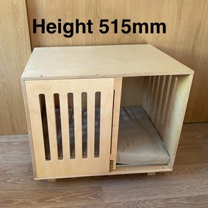 Modern dog crate with sliding door with a latch. Dog kennel, dog house, dog bed, indoor dog house, dog furniture, dog cage. Natural wood.