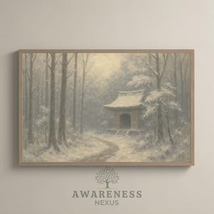 May include: A framed print of a serene winter landscape. The artwork depicts a snow-covered forest with a traditional Japanese building. The color palette is muted, with shades of gray, white, and beige. The print is in a light-colored wooden frame.