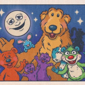 May include: A vibrant illustration depicting a large brown bear with several smaller bears in different colours. A smiling moon and stars are set against a blue background. The artwork has a whimsical, cartoonish style.