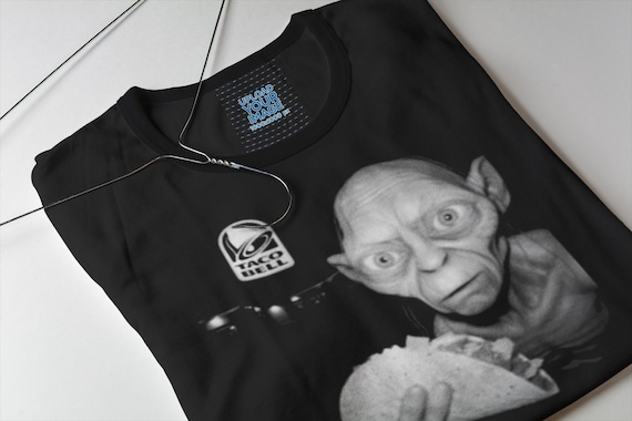 Gollum says it's time for elevensies. Buy this shirt before filthy hobitses takes them all. This LOTR / Taco Bell collab is precious.