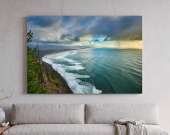 Oregon Coast on a rainy day at photo print, dramatic sky over Pacific Ocean and Manzanita Beach, PNW coastal landscape with dramatic mood.