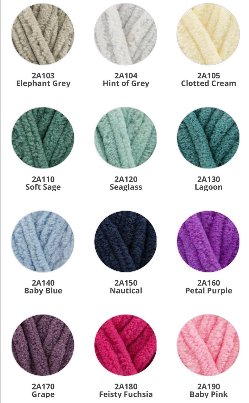 May include: A collection of 12 yarn skeins in various colors, including elephant grey, hint of grey, clotted cream, soft sage, seaglass, lagoon, baby blue, nautical, petal purple, grape, feisty fuchsia, and baby pink. Each skein is labeled with a color name and a product code.