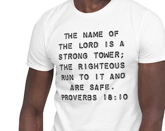 May include: A white t-shirt with black text that reads "THE NAME OF THE LORD IS A STRONG TOWER; THE RIGHTEOUS RUN TO IT AND ARE SAFE. PROVERBS 18:10". A person is wearing the t-shirt.