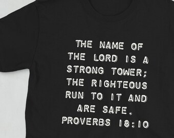May include: Black t-shirt with white text that reads "THE NAME OF THE LORD IS A STRONG TOWER; THE RIGHTEOUS RUN TO IT AND ARE SAFE. PROVERBS 18:10"