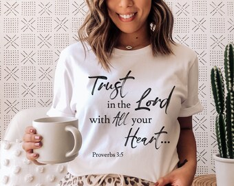 May include: White t-shirt with the text "Trust in the Lord with all your Heart... Proverbs 3:5" printed in black.