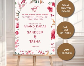 May include: A white foam printed board with floral accents and text welcoming guests to the Anand Karaj of Sandeep & Tasha. The sign is displayed on a wooden easel. The text is fully editable.