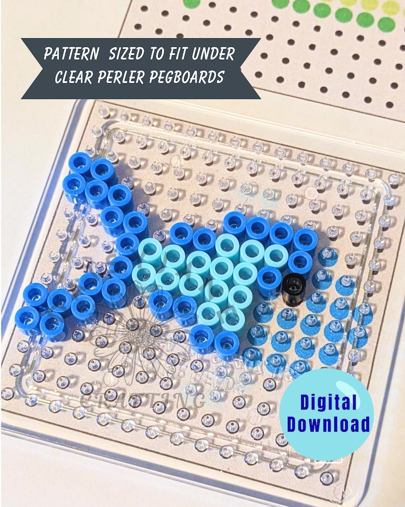 May include: A clear Perler bead pegboard with a fish design made of blue and light blue beads. The design is on a white background with the text "PATTERN SIZED TO FIT UNDER CLEAR PERLER PEGBOARDS" and "Digital Download".