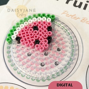 May include: A watermelon design made with Perler beads on a clear pegboard. The watermelon features pink, white, green, and black beads, arranged in a circular shape. The words "DIGITAL DOWNLOAD" are on a pink oval. The image also includes the text "Fruit" and "Perler Beads".