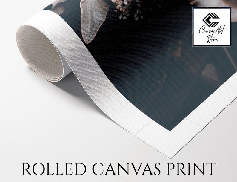 May include: A rolled canvas print featuring a dark floral image with muted tones. The white border of the canvas is visible as it curls upwards. A square logo in the top right corner contains the text Canvas Art Store. The text ROLLED CANVAS PRINT appears below.