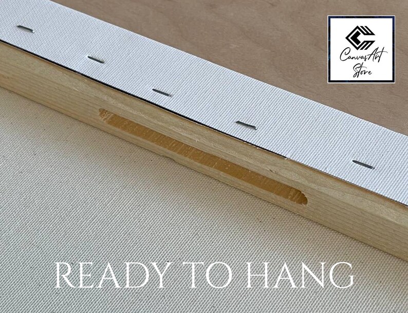 May include: A wooden canvas stretcher bar frame with white canvas fabric pulled taut and secured with metal staples along the edge. The frame features a recessed slot and the text READY TO HANG is printed below. A logo for Canvas Art Store is visible.