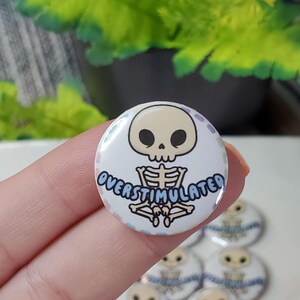 Holographic Overstimulated Skeleton Button Pin: Mental Health Awareness