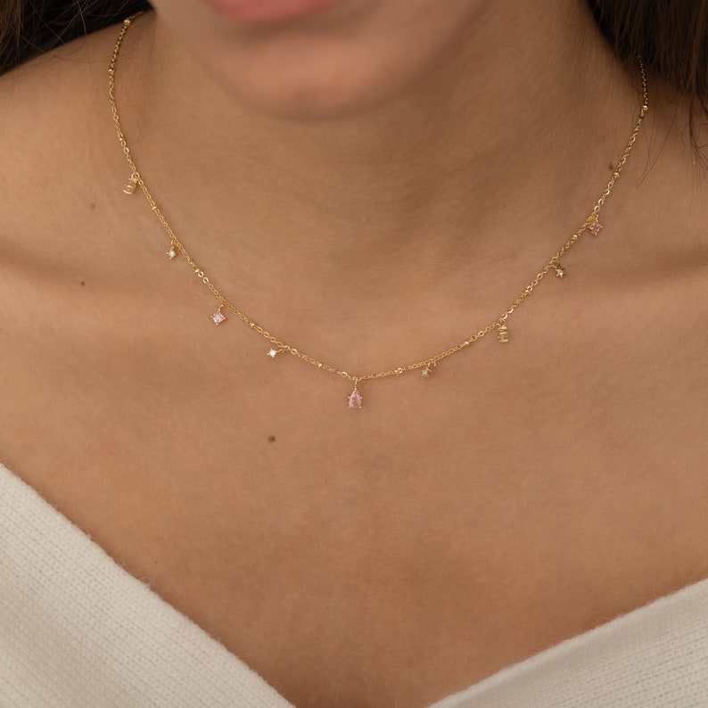 a close up of a woman wearing a necklace