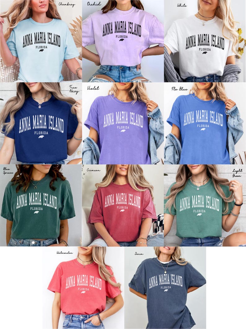 May include: A collection of t-shirts in various colors, each featuring the text "ANNA MARIA ISLAND FLORIDA" in a bold, arched font. The shirts are displayed on models, showcasing the different hues available, including blue, white, and red.