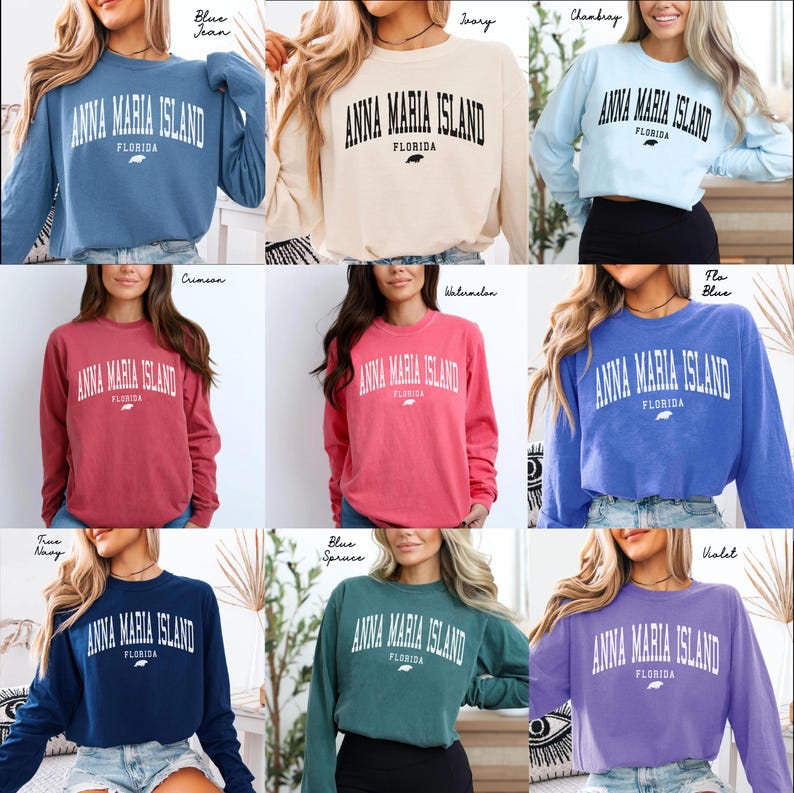 May include: A collection of long-sleeved sweatshirts in various colors, each displaying the text "ANNA MARIA ISLAND FLORIDA" in a white, arched font. The sweatshirts are in shades like blue, ivory, crimson, and violet.