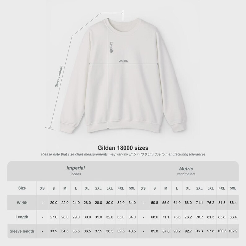 Pode incluir: Camisola branca Gildan 18000 com tabela de tamanhos. A tabela mostra medidas em polegadas e cent&iacute;metros para largura, comprimento e comprimento da manga, variando de XS a 5XL. O texto "Gildan 18000 sizes" tamb&eacute;m &eacute; vis&iacute;vel.
