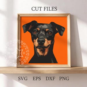 May include: A framed print featuring a stylized portrait of a dog with black and tan fur against an orange background. The text "CUT FILES" is at the top, and "SVG EPS DXF PNG" is at the bottom. The print is displayed on a wooden shelf.