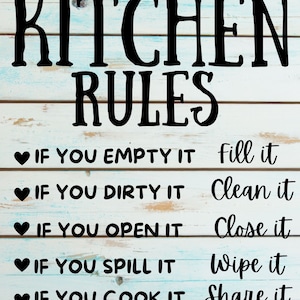 May include: A white wooden sign with black text that reads "KITCHEN RULES" and lists five rules for the kitchen: "If you empty it, fill it", "If you dirty it, clean it", "If you open it, close it", "If you spill it, wipe it", and "If you cook it, share it".