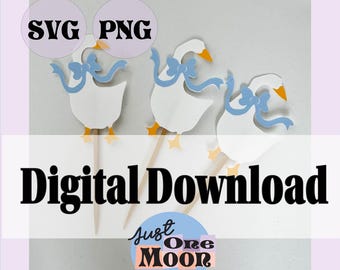 May include: Three white goose cupcake toppers with orange beaks and feet, each wearing a light blue bow. The image includes the text SVG, PNG, Digital Download, and Just One Moon with a floral graphic. These are paper cutouts on wooden sticks.