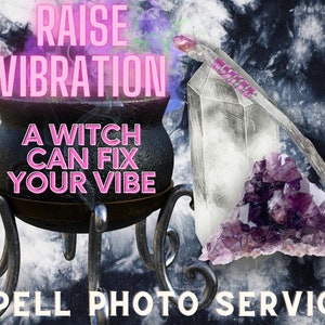 May include: A black cauldron with the text "A witch can fix your vibe" sits on a silver stand. A large clear crystal with a wooden wand and a purple amethyst crystal are in the background. The text "Raise Vibration" and "Spell Photo Service" are also visible.