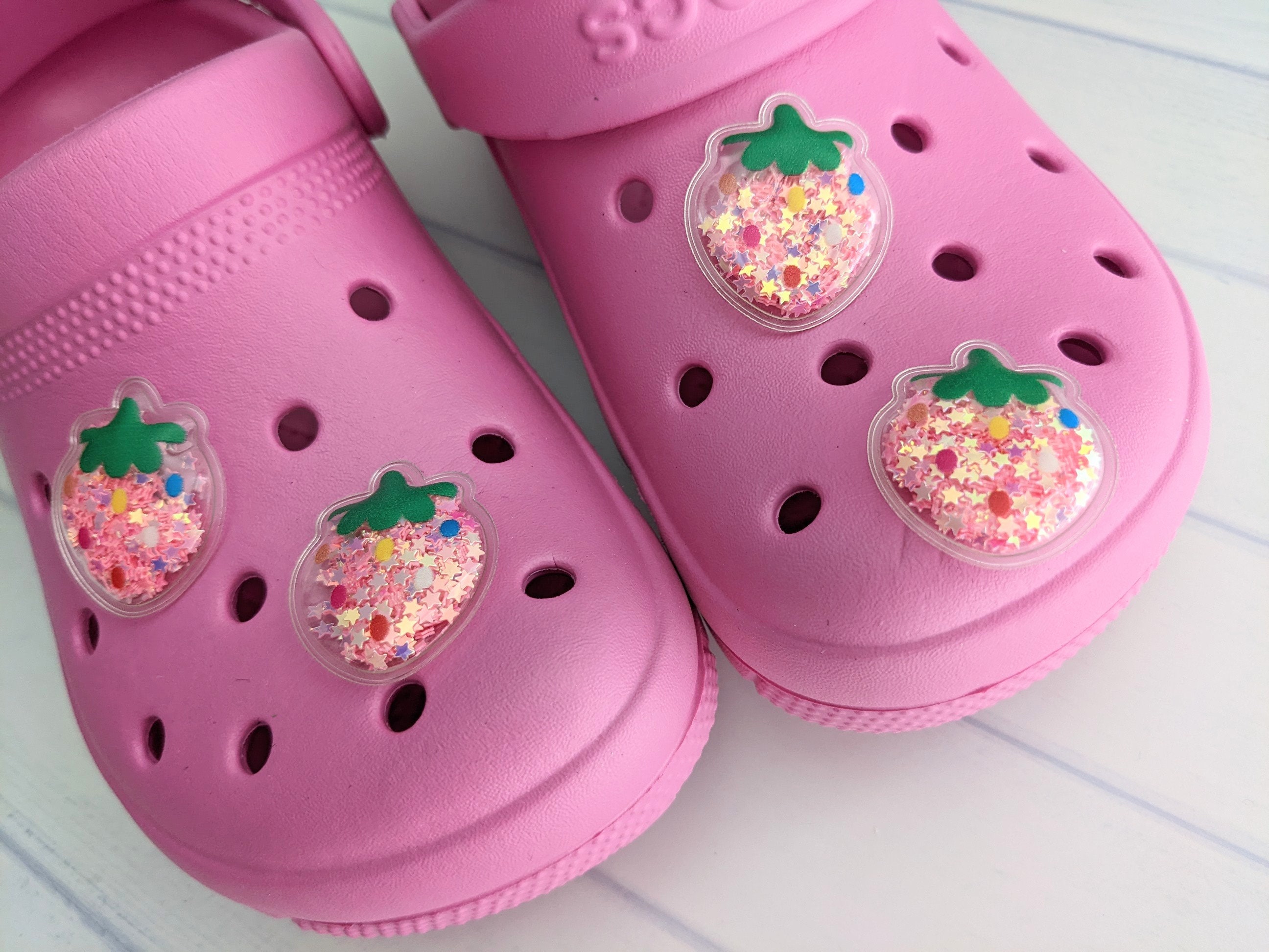 Bling charms on pink crocs… #croccharmbusiness #soprettycharms