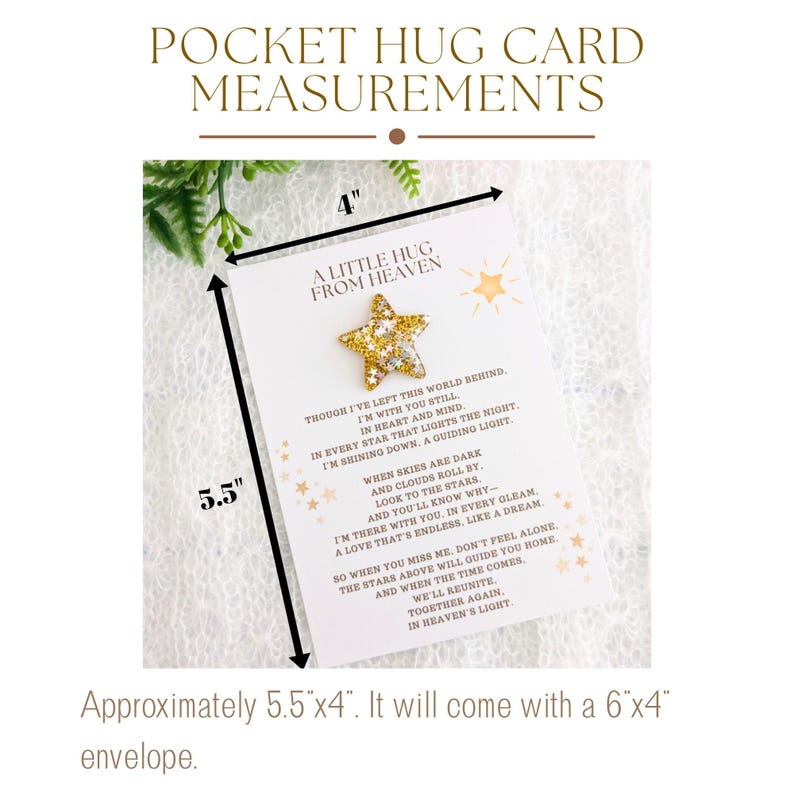 May include: A white card with gold glitter accents and a gold star charm. The card measures 5.5 inches by 4 inches and reads "A Little Hug From Heaven". The card includes a poem about being with someone in spirit and a reminder that they are always there.