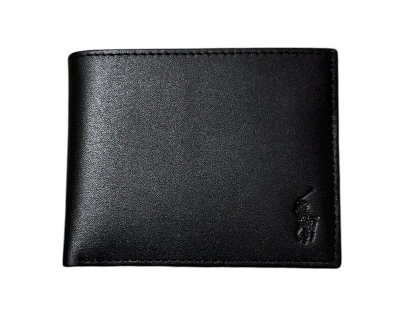 May include: Black leather wallet with a subtle texture. The wallet features a bi-fold design and a small embossed logo on the lower right corner. The stitching around the edges is visible. A classic accessory.
