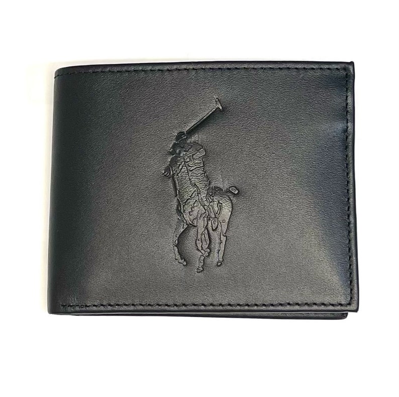 May include: A black leather wallet with an embossed polo player logo.