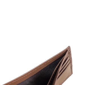 May include: An open brown leather wallet with multiple card slots and a billfold. The wallet is empty.