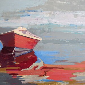 May include: A red boat with a white stripe is docked in a calm body of water. The water is a light blue with a reflection of the boat in the water. The sky is a light gray with a few clouds.