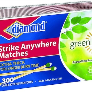 May include: A box of 300 Diamond Strike Anywhere Matches with a greenlight logo. The box is blue and white with a green and yellow sun graphic. The matches are extra thick for longer burn time. Sourced from responsible forests.