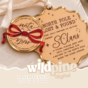 May include: A gold-toned metal ornament shaped like a button and a scalloped tag. The button features a red ribbon and the text 'Jolly Uniform Co. Property of Santa'. The tag reads 'North Pole Lost & Found' and 'Owner: S. Claus' with star accents.