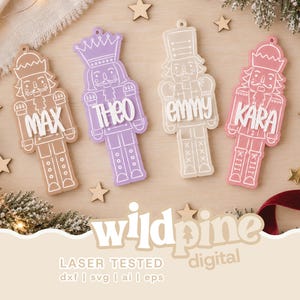 May include: Four flat nutcracker ornaments in tan, lavender, cream, and pink, each featuring white line art details and a raised white name tag reading MAX, THEO, EMMY, or KARA. Each ornament has a small hole at the top for hanging.