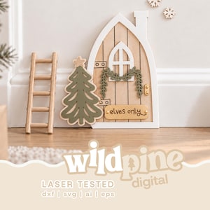 May include: A wooden fairy door with a white frame, a small arched window, and a green garland. Beside it stands a wooden ladder and a green Christmas tree cutout. A gold plaque on the door features the text "elves only" in black script lettering.